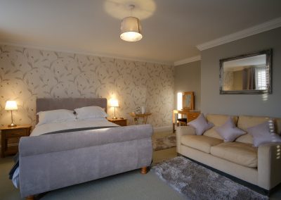 manor farmhouse bedroom 3 bed and sofa