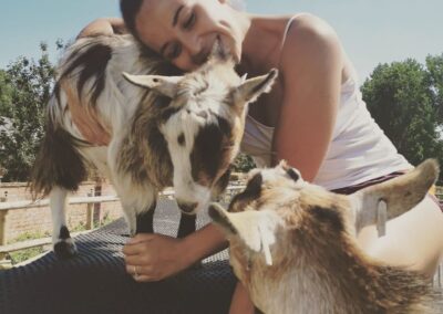 kayleigh hugging a pygmy goat